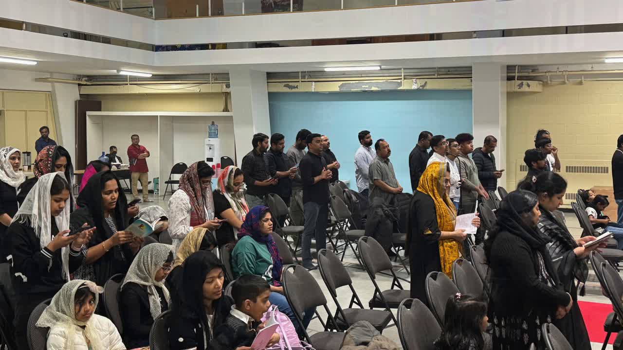 Congregation gathered in a church hall.
